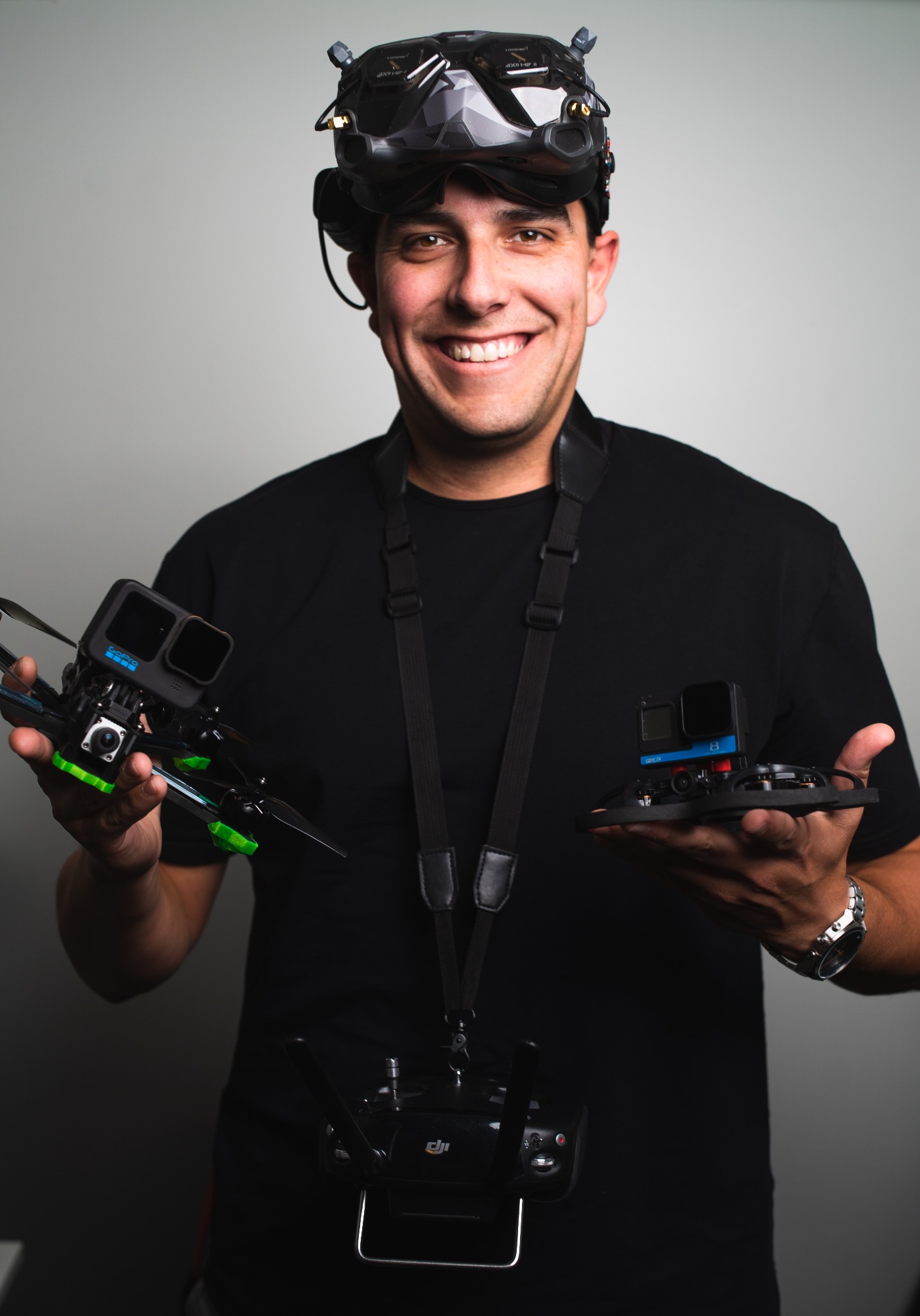 Nathan Montanez holding FPV drones and wearing FPV goggles